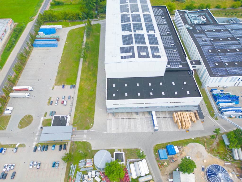 industry-with-low-carbon-footprint-industrial-warehouses-with-solar-panels-on-the-roof-technology-park-and-factories-from-above